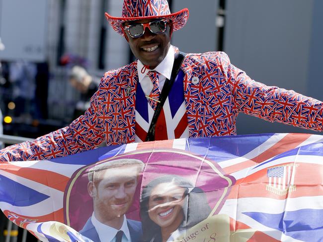 A royal fan waves a flag in Windsor.