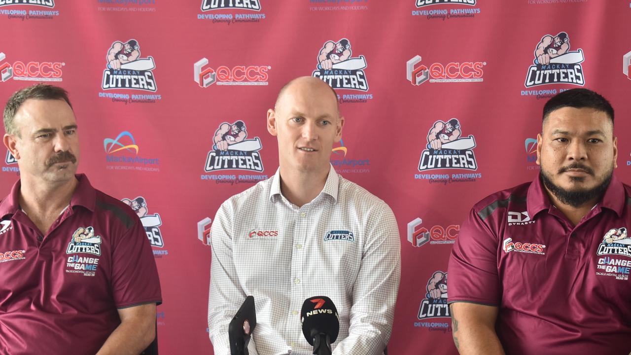 Head of Football Kim Williams, CEO Mitch Cook and coach Marco Peters front the media after their announcement of the 2023 BDP Womens team running out of Mackay