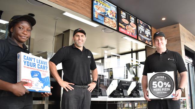 Morgan Wilkins and staff at Eden's Crossing new Dominos store.