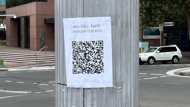 RAT tests were advertised for sale for $300 via QR codes on signposts near a Sydney station. Picture: News.com.au.