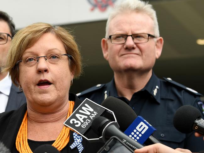 Victorian Minister for Police Lisa Neville (centre) and Victoria Police Assistant Commissioner Stephen Leane (right) hold a press conference about planned security procedures for the AFL grand final parade and AFL grand final at the MCG, Thursday September 28, 2017. Anti-terror bollards will line the AFL grand final parade route and other thoroughfares leading to the MCG as Victoria Police ramp up security for footy's big day. (AAP Image/Joe Castro) NO ARCHIVING