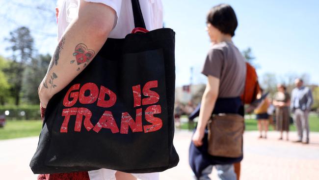 A transgender activist attends a university protest.