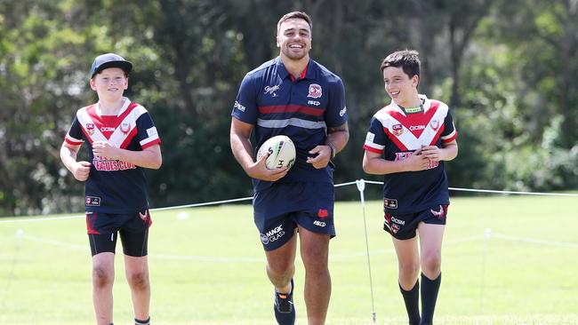 Roosters player Matt Ikuvalu with Erina Eagles juniors Billy Sands and Tyrone Sayers at Central Coast Roosters Gala Opening Saturday 29th February 2020 at Tuggerah Lakes Secondary College The Entrance campus. Picture: Sue Graham