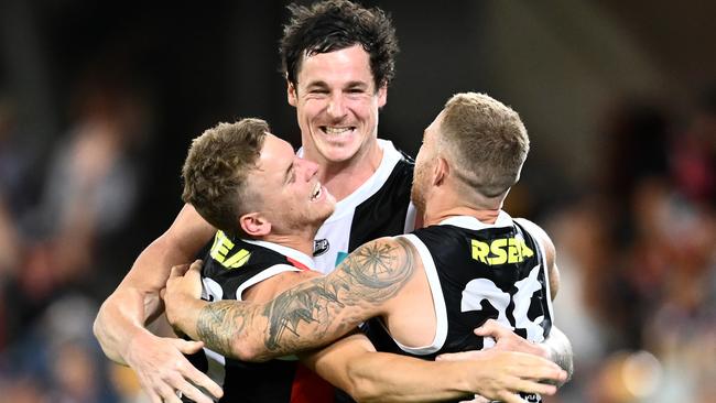 BRISBANE, AUSTRALIA - OCTOBER 03: Jack Lonie, Jake Carlisle and Jack Sinclair of the Saints celebrate after the Saints defeated the Bulldogs during the AFL Second Elimination Final match between the St Kilda Saints and the Western Bulldogs at The Gabba on October 03, 2020 in Brisbane, Australia.  (Photo by Quinn Rooney/Getty Images)