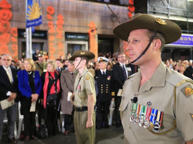 In memoriam ... Soldiers and the public gather for the dawn service at Martin Place Cenotaph for the 100th Anzac Day. Picture: Craig Greenhill