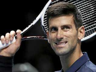 Novak Djokovic of Serbia celebrates winning match point against David Goffin of Belgium during their ATP World Tour Finals singles tennis match at the O2 Arena in London. Picture: Kirsty Wigglesworth