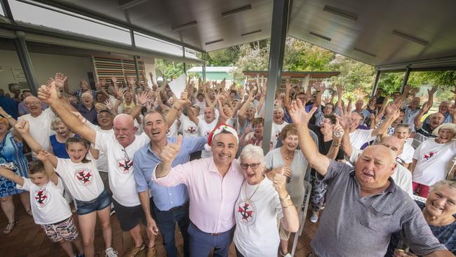 The Iluka community who gathered at the Iluka Bowling Club celebrate the announcement with deputy premier John Barilaro they will get an ambulance station.