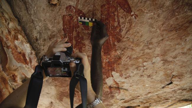 Traditional Owner Uriaha Waina and Cecilia Myers documenting Tassel Gwion figures in Drysdale River National Park. Picture: Mark Jones. Images supplied by Rock Art Australia. Picture credit: Balanggarra Aboriginal Corporation