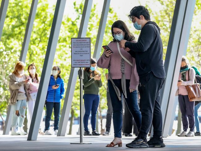 People line up for a Covid vaccine at the Melbourne Convention Centre. Picture: Ian Currie