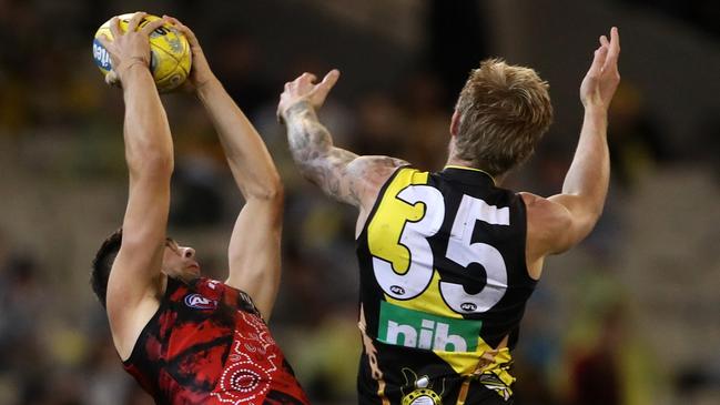 Essendon’s Kyle Langford outmarks Nathan Broad during a Dreamtime at the G clash.