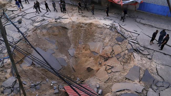 Palestinians inspect the site of an Israeli army airstrike on the European Hospital in Khan Younis, Gaza Strip. Picture: AP Photo