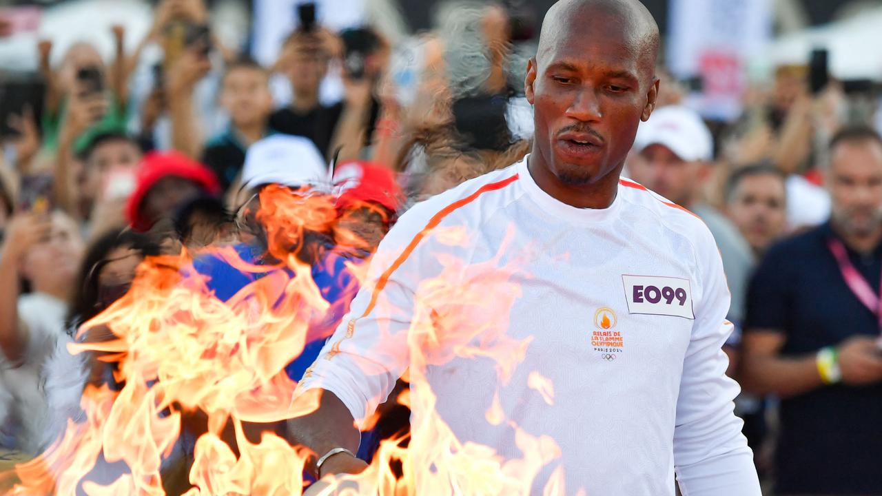 French Ivorian former football player Didier Drogba uses the Olympic torch to light the Olympic cauldron, also designed by Mathieu Lehanneur, at the Stade Velodrome in Marseille on May 9. Picture: Sylvain Thomas/AFP