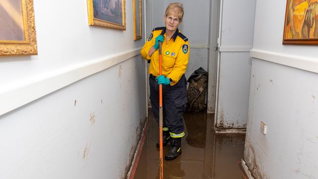 Rural Fire Service volunteer Lorraine Stair has been working 12-hour days to help clean properties in Wingham. Picture: Thomas Lisson