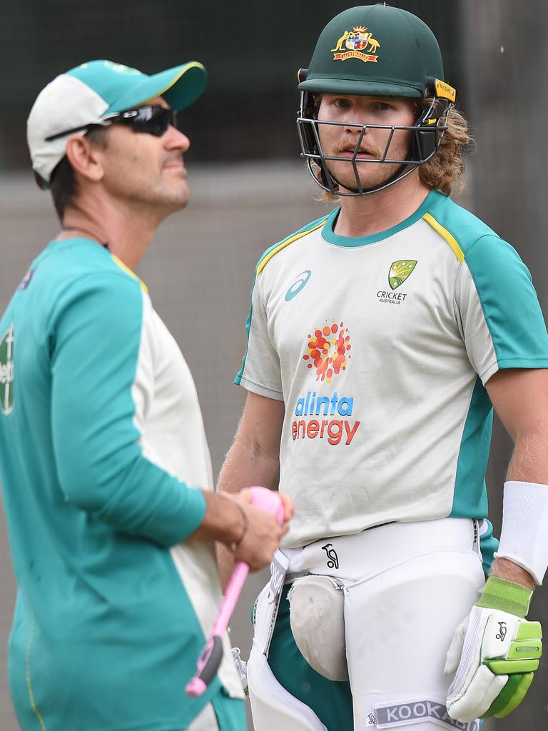 Langer talks to Will Pucovski in the nets.