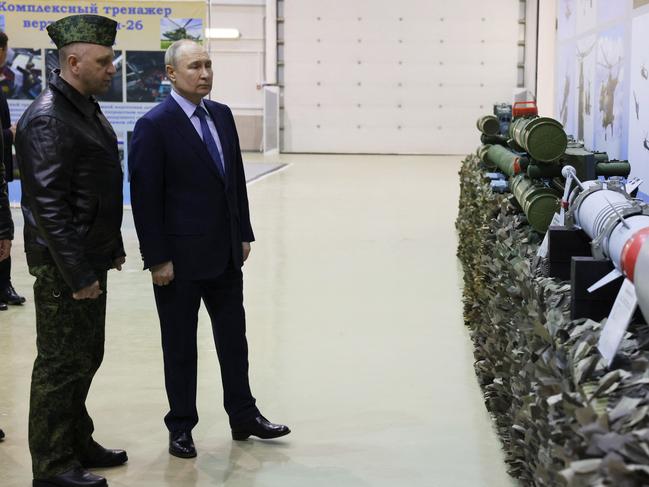 Vladimir Putin inspects Russian weapons. Picture: AFP