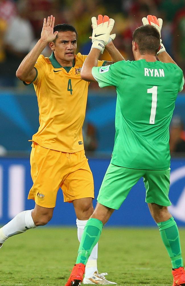 Tim Cahill celebrates his goal against Chile with Mat Ryan.