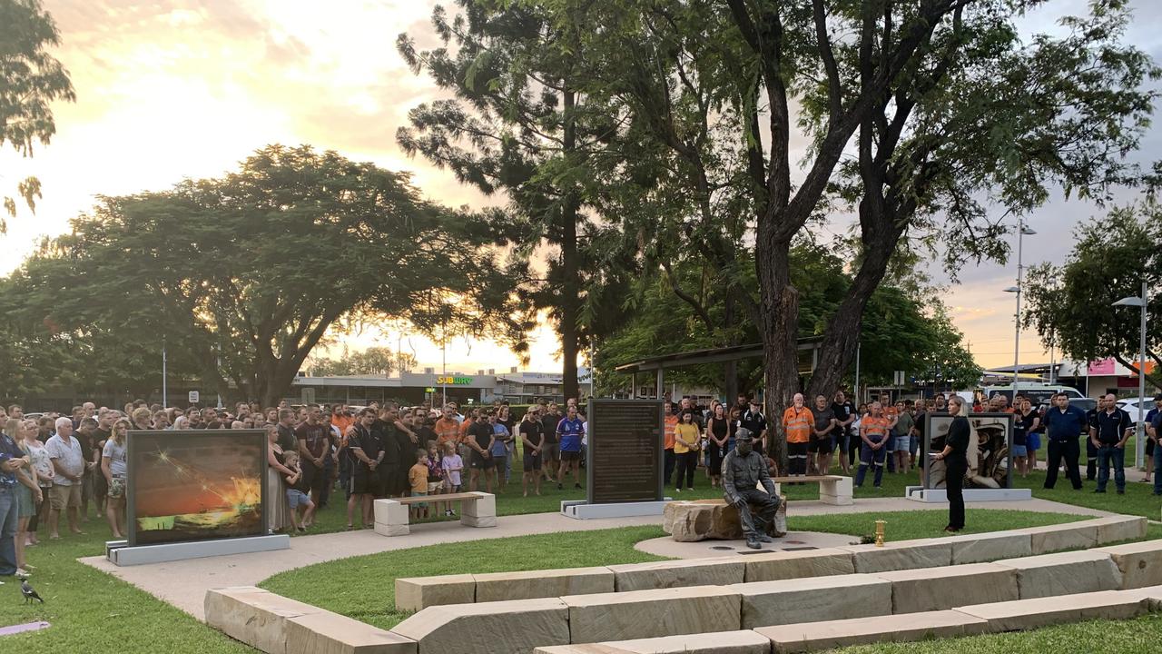 Councillor Kelly Vea Vea (standing right) speaks to the gathered crowd at the Moranbah Miners' Memorial before marking one minute's silence in memory of Moranbah North miner Gavin Feltwell. Picture: Duncan Evans