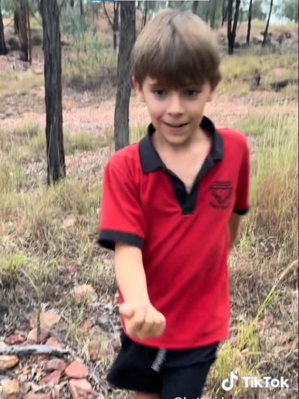 Seven-year-old Riley Betteridge discovered a valuable gemstone just metres from his family’s doorstep in Queensland’s gemfields. Picture: TikTok