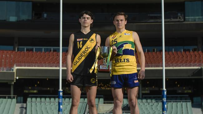 Under-16 captains Archer Rouvray (Glenelg) and Jett Hasting (Eagles) with the premiership cup. Picture: Roy Vandervegt