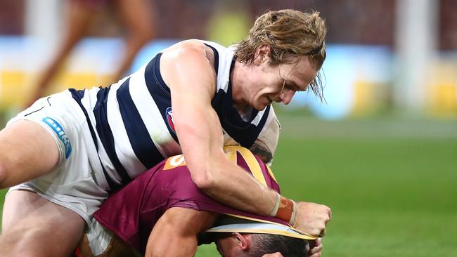 Tom Stewart gives away a 50m penalty for dragging and shoving Charlie Cameron to the ground. Picture: Chris Hyde/AFL Photos/via Getty Images