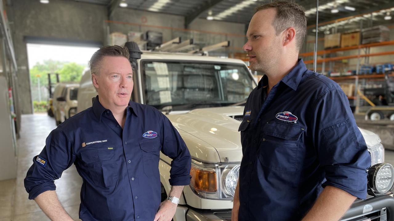 Powerlink Queensland chief executive Paul Simshauser talks about job numbers and timeframes of the Copperstring project with employee Chris Garlick.