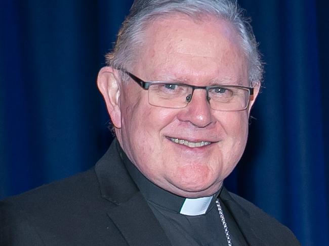 Archbishop Mark Coleridge and Brisbane Catholic Education Executive Director Pam Betts present Seton College teacher Kathryn Flint of Seven Hills one of the top honours at the Excellence in Learning in Teaching in a Secondary School awards.