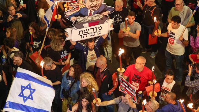 Relatives and supporters of Israeli hostages held in Gaza since the October 7 attacks by Hamas militants demonstrate in front of the Defence Ministry in Tel Aviv. Picture: AFP.