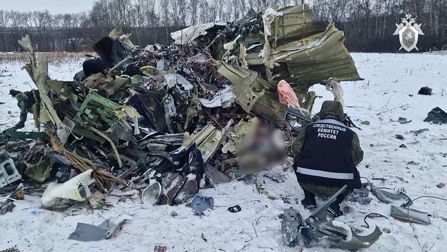 An aviation investigator works at the Russian IL-76 military transport plane crash site in the Belgorod region. Picture: Russian Investigative Committee via AFP