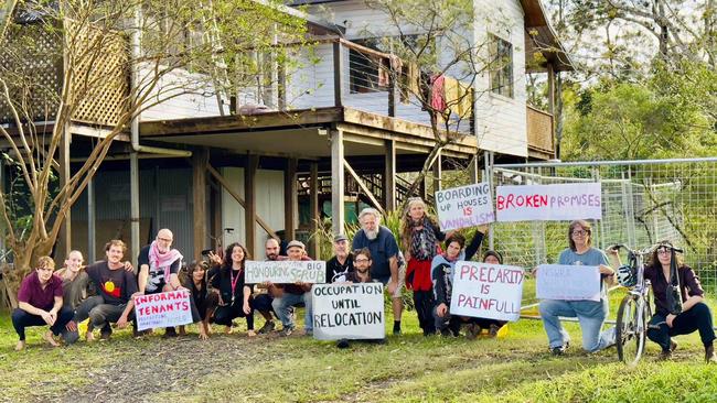 Northern Rivers residents unable to find secure accommodation who are now squatting in a buyback home in North Lismore want to remain in the home until it is relocated off the flood plain, despite threats of police involved eviction.