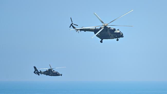 Chinese military helicopters fly past Pingtan island, one of mainland China's closest point from Taiwan, in Fujian province on August 4. Picture: AFP