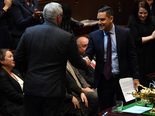 NSW Minister for Health and Medical Research Brad Hazzard (left) congratulates NSW Member for Sydney Alex Greenwich as he introduces the Reproductive Healthcare Reform Bill. Picture: AAP