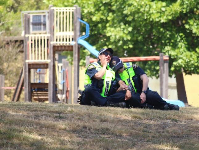 Police officers comfort each other at Hillcrest Primary School after the incident. Picture: ABC News