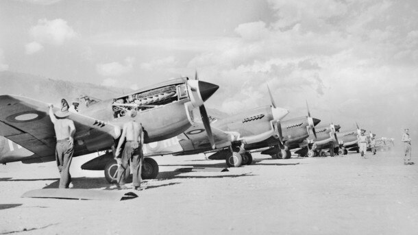 Jackson’s No. 75 Squadron flew Kittyhawks, like lined up in New Guinea. Picture: Australian War Memorial