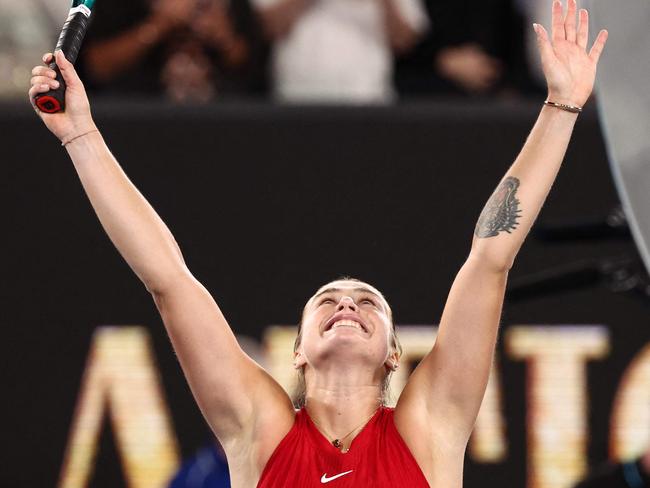 Belarus' Aryna Sabalenka celebrates after victory against China's Zheng Qinwen during their women's singles final match on day 14 of the Australian Open tennis tournament in Melbourne on January 27, 2024. (Photo by David GRAY / AFP) / -- IMAGE RESTRICTED TO EDITORIAL USE - STRICTLY NO COMMERCIAL USE --