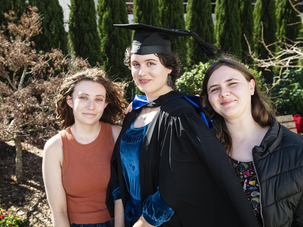 Bachelor of Biomedical Sciences with distinction graduate Tijana Ivanovic with friends Mia Wheatley (left) and Zarah Martin at a UniSQ graduation ceremony at Empire Theatres, Wednesday, June 28, 2023. Picture: Kevin Farmer