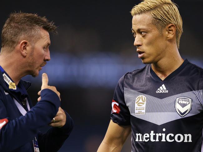 MELBOURNE, AUSTRALIA - MARCH 16: Keisuke Honda of the Victory listens to his interpreter during the A-League Rd 22 match between Melbourne Victory and Brisbane Roar at Marvel Stadium on March 16, 2019 in Melbourne, Australia. (Photo by Michael Dodge/Getty Images)