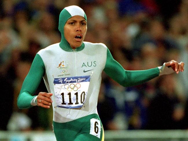25 Sep 2000:  Cathy Freeman of Australia crosses the line to win gold in the Womens 400m Final at the Olympic Stadium on Day 10 of the Sydney 2000 Olympic Games in Sydney, Australia.  \\ Mandatory Credit: Mike Powell /Allsport