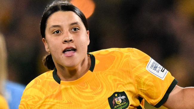 FILES-- This file photo taken on August 16, 2023 shows Australia's forward Sam Kerr celebrating scoring her team's first goal during the Australia and New Zealand 2023 Women's World Cup semi-final football match between Australia and England at Stadium Australia in Sydney. Chelsea and Australian women's football star Sam Kerr has been charged with a "racially aggravated offence" in Britain following a dispute involving a police officer, London's Metropolitan Police said March 4.  The 30-year-old striker, one of the highest profile and best-paid players in the women's game, was charged following an incident in London in January 2023, a police statement read. (Photo by IZHAR KHAN / AFP)