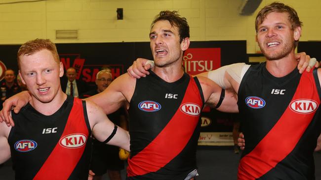 Jobe Watson sings the club song with Josh Green and Michael Hurley. Picture: Getty Images