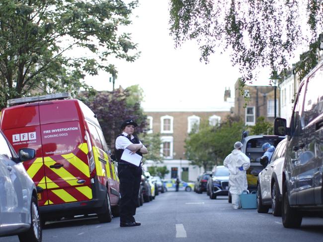 A police officer is seen in Kentish Town, near British Prime Minister Keir Starmer's house in north London, Monday, May 12, 2025. (James Manning/PA via AP)
