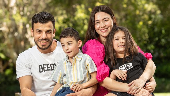 23/10/23. The Daily Telegraph, News.Hurstville, Sydney, NSW, Australia.Portraits of boxer Youssef Dib pictured in Zetland with his wife Nicole and kids Aaliyah (4) and Jibreel (3) who has cerebral palsy.Youssef is a world-ranked boxer fighting hard for a world title shot. He is washing cars on the side to fund his boxing ambitions and to also support a young family with one child suffering Cerebral palsy.Picture: Julian Andrews