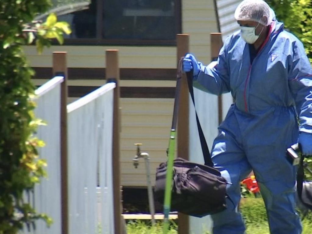 A police forensic officer at the North Mackay address after the death of a two-year-old girl. Credit: 7NEWS