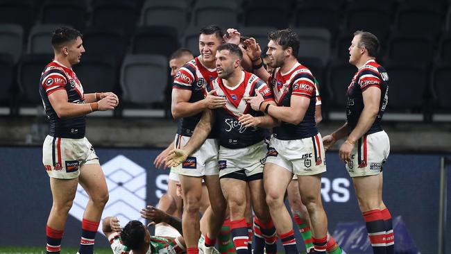 James Tedesco celebrates with his teammates after scoring against South Sydney. Picture: Getty