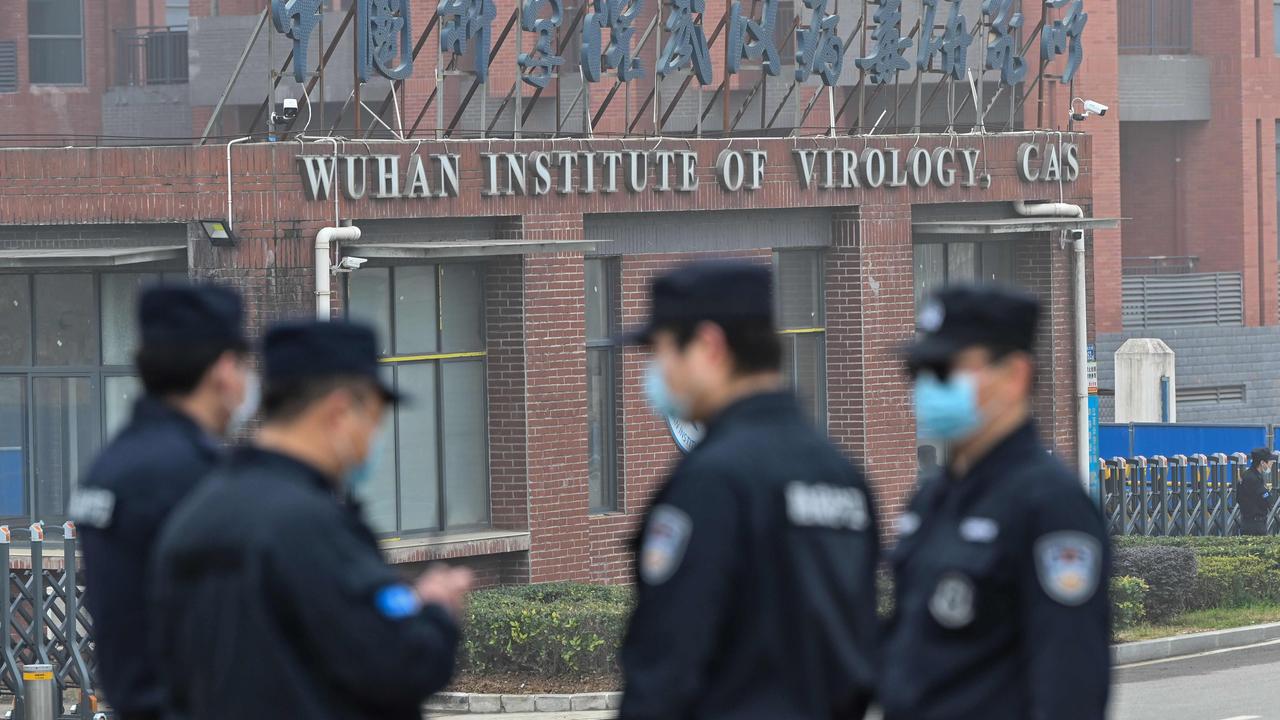 Security personnel stand guard outside the Wuhan Institute of Virology. Picture: Hector Retamal/AFP