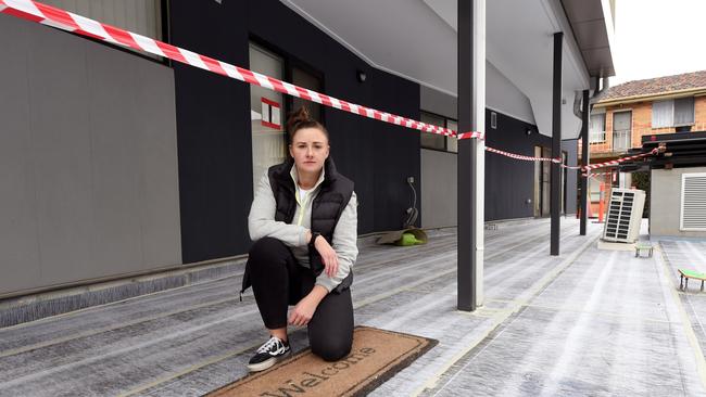 Apartment owner Steph Webb, who bought a flat in her mid-20s thinking she was putting herself financially ahead. She is sitting amid rectification works. Picture: Nicki Connolly/news.com.au