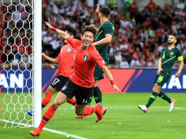 South Korea's Hwang Ui-jo (front) celebrates his goal against Australia during a friendly football match in Busan on June 7, 2019. (Photo by - / YONHAP / AFP) / - South Korea OUT / REPUBLIC OF KOREA OUT  NO ARCHIVES  RESTRICTED TO SUBSCRIPTION USE