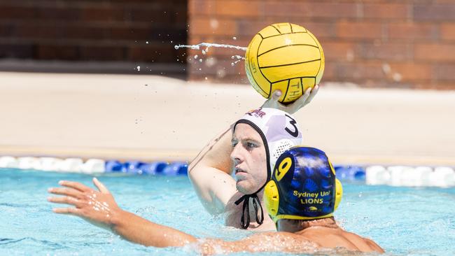 William Downes from Queensland Thunder prepares to pass. (AAP Image/Renae Droop)