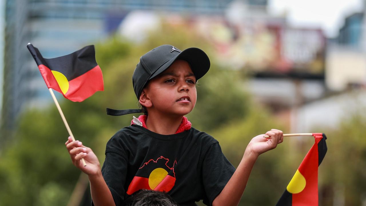 SYDNEY, AUSTRALIA - JANUARY 26: Demonstrators march towards Victoria Park during an Invasion Day protest on January 26, 2024 in Sydney, Australia. Australia Day, formerly known as Foundation Day, is the official national day of Australia and is celebrated annually on January 26 to commemorate the arrival of the First Fleet to Sydney in 1788. Many indigenous Australians refer to the day as Invasion Day and there is a growing movement to change the date to one which can be celebrated by all Australians. In 2024, supermarket Chains Woolworths and Aldi announced that they would stop stocking themed merchandise for the day, drawing a political backlash from opposition leader Peter Dutton. (Photo by Roni Bintang/Getty Images)