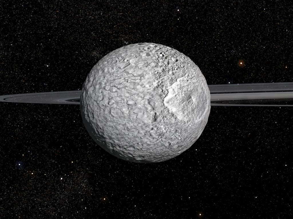 This handout image released on February 7, 2024 by Animea Studio - Observatoire de Paris - PSL, IMCCE - shows an artist's impression of the 400-km diameter Mimas, one of Saturnâs small moons. Astronomers compare it to the Death Star from Star Wars, but it turns out to be more hospitable than imagined: Mimas, a small moon of Saturn, contains an unlikely liquid ocean under its icy surface, ideal for the appearance of life, according to a study published on February 7, 2024. (Photo by Frederic Durillon / Animea Studio | Observatoire de Paris - PSL, IMCCE / AFP) / - NO Editorial use - NO Marketing campaign / -----EDITORS NOTE --- RESTRICTED TO EDITORIAL USE - MANDATORY CREDIT "AFP PHOTO /  HO / ANIMEA STUDIO - OBSERVATOIRE DE PARIS - PSL - IMCCE" - NO MARKETING - NO ADVERTISING CAMPAIGNS - DISTRIBUTED AS A SERVICE TO CLIENTS /
