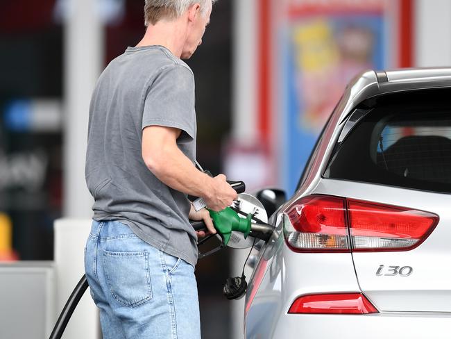 BRISBANE, AUSTRALIA - NewsWire Photos - AUGUST 10, 2021., A man fill up his car at a service station in Woolloongabba, Brisbane. Despite a drop in oil prices unleaded fuel remains high across the country's capital cities at $1.73 a litre in Brisbane, $1.63 in Adelaide, $1.55 in Melbourne and $1.45 in Sydney., Picture: NCA NewsWire / Dan Peled